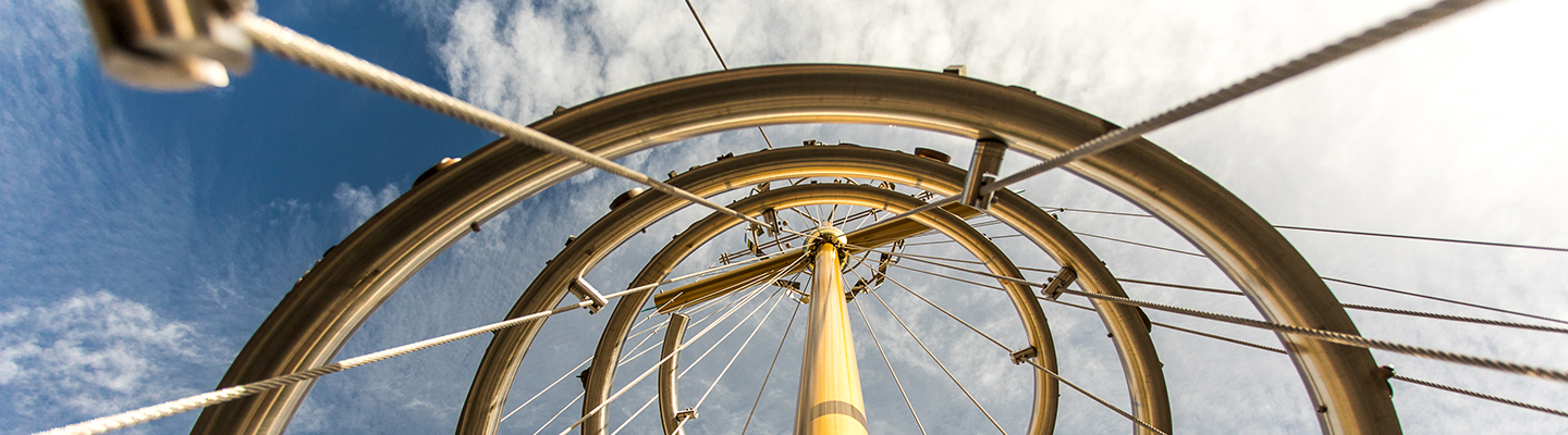 Tree of Life sculpture against a blue sky
